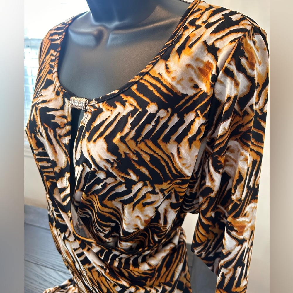 NY Collection Dress with gold hardware accent. Faux half wrap at the waist
